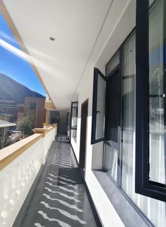 Luowu Tibetan Homestay Отели рядом с достопримечательностью «Baimazhai Village»