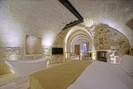 Kappadoks Cave Hotel Отели в г. Tekelli Mahallesi