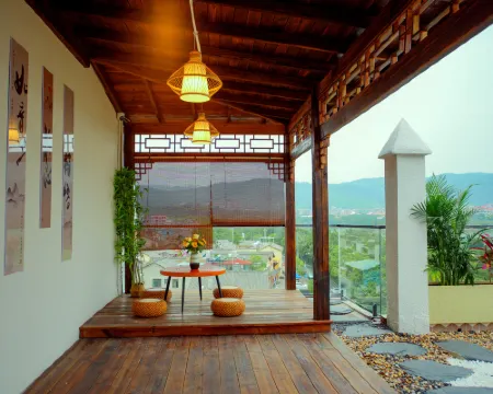 Maitreya Huxi Man Hot Spring Homestay (Huquan Water Town Tourist Resort Scenic Area Branch) Hoteles en Ciudad de Mile