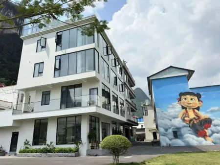 Yueliangshan Quanju Отели в г. Машань