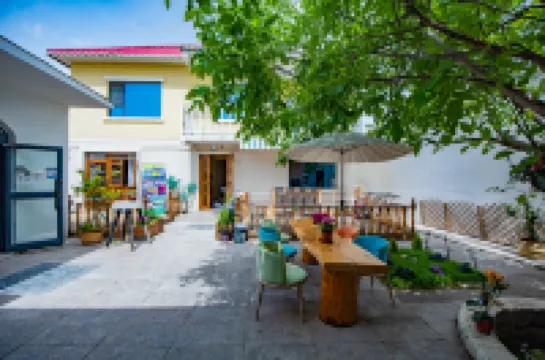 特克斯奶嘴象民宿（盛世華疆八卦城之夜店）