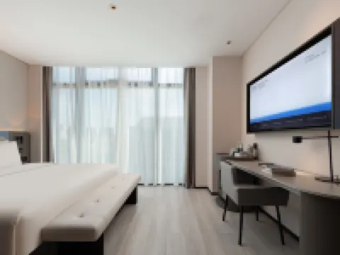 Cixi Sports Center Xinhefang Light Residence Hotel Hoteles en Cixi