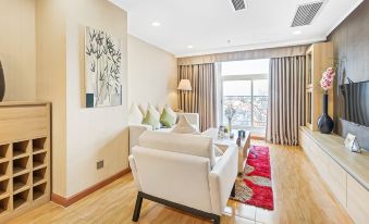 a modern living room with white furniture , a wooden floor , and large windows that offer views of the city at Super Hotel Candle