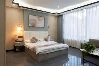 Mangkang Rumei Yijiang Kaiyue Hotel