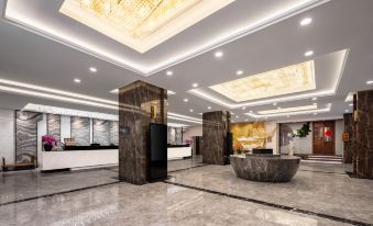 A spacious room with an atrium and marble countertops in the lobby or reception area at Shanghai Shaanxi Business Hotel