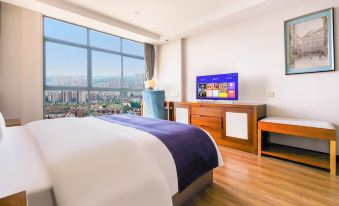 a modern bedroom with a large window overlooking the city , featuring a comfortable bed and a flat - screen tv at COMO