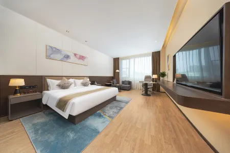 Shanxi International Sports Exchange Center. Hotel MoMc (Red Lantern Stadium) Отели рядом с достопримечательностью «Taiyuan Botanical Garden»