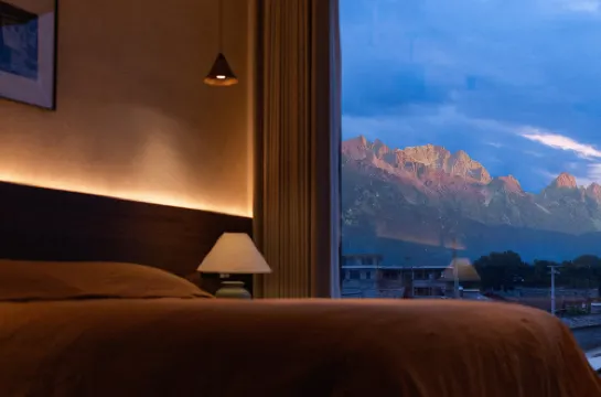 Experience the breathtaking panorama of snow-capped mountains in a luxurious villa.