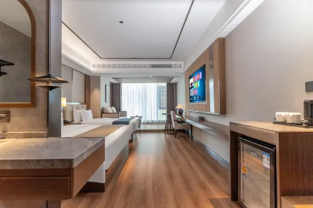 Xishuangbanna Mengbangya Holiday Hotel (Yudafo Temple) Отели рядом с достопримечательностью «Xishuangbanna Folk Custom Garden»