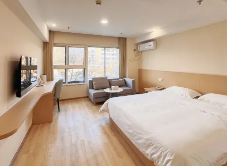 Weihai Yujing Business Hotel Отели рядом с достопримечательностью «Aodaliya Kunshilan Occupation Technology (Nan'an) College Weihai Branch»