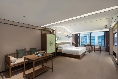 Mo Shang Qing Ju Hotel (Quliang Garment Industrial Park, South University Road, Zhengzhou) Отели в г. Синьми