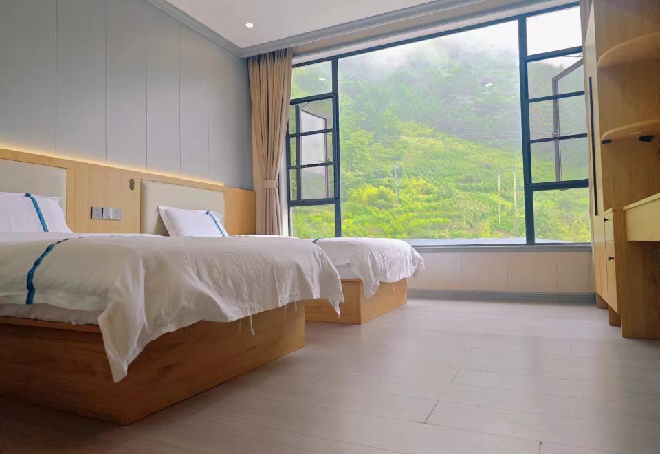 [Wolong Nature Reserve Gengda Bamei Chinese Inn의 깔끔한 객실]