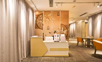 The reception desk is situated in the hotel lobby, which features an art deco design at China Hotel