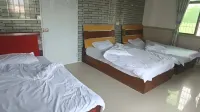 Xinggang Homestay Hoteller i Tieshangang District