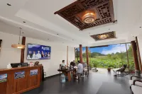 Puzhehei Riverside Inn - Parkplatz