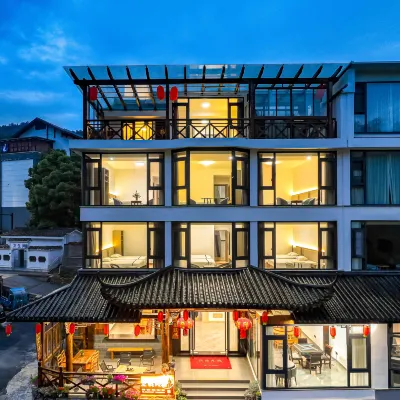 Hulu Ciwangxilou Homestay โรงแรมใกล้หมู่บ้านรูทซ์