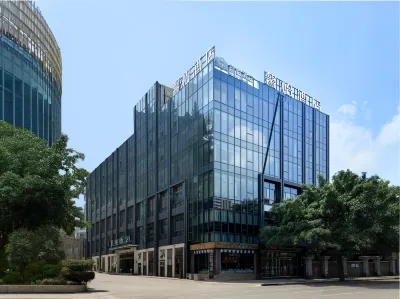 Xinyi Hotel Отели рядом с достопримечательностью «Универмаг Кошапо»