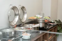 โรงแรมและอพาร์ตเมนต์ ทีคิว ลักชัวรี - พร้อมอาหารเช้า