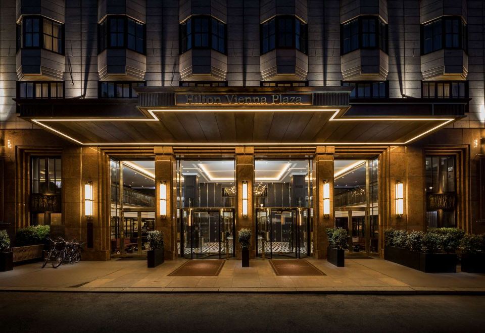 "a large building with a glass door entrance and the words "" tanjong puteri hotel "" written above it" at Hilton Vienna Plaza