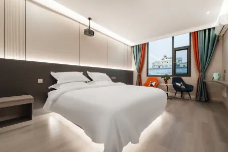 Hejing Film and Television Hotel (Mengzi Wencui Road Min'an Road Branch) Отели рядом с достопримечательностью «Honghe College»