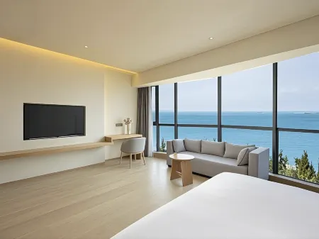 Chenhui Business Hotel (Hainan International Convention and Exhibition Center) Отели рядом с достопримечательностью «Jinshawan Coastal Park»