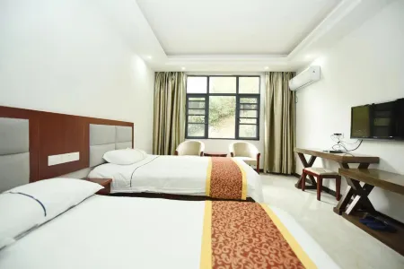 ParadiseVillagexijieyuanxijieyuanxijieyuanBreakfast Отели рядом с достопримечательностью «Baima Canyon»