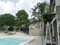 Xingyi Wanfeng Linyi Boutique Inn (Wanfenglin Baguatian Attractions) - ที่มีสระว่ายน้ำ