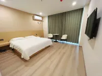 Mufeng Hotel (Xinzheng Longan Community Sanhaoyuan)