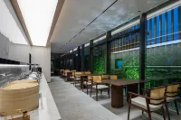 โรงแรมสโตนแอนด์แบมบู (สถานีรถไฟหนานจิงใต้) - พร้อมอาหารเช้า