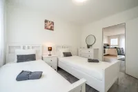 Modern Swiss Apt | spacious garden + parking