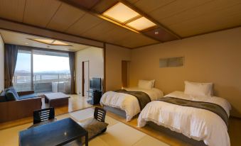 a modern japanese - style bedroom with wooden ceiling , white bedding , and a large window offering a view of the outdoors at Biwako Ryokusuitei