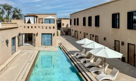 Kuqa SAYAU Holiday Boutique Hotel Отели рядом с достопримечательностью «Qingchengqiang Site»