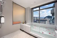 Bairan Private Hot Spring Smart Cinema Design Hotel (Xingyi Jushan Square Huijin Center)