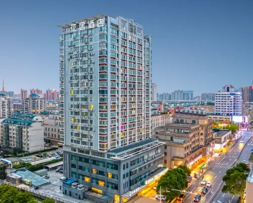 Huaju Hotel (Wenfeng World Store, Middle Jianghai Road, Qidong) Hoteles en Qidong