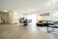 Modern Swiss Apt | spacious garden + parking