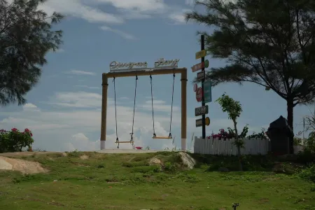 Peninsula Holiday Hotel Отели рядом с достопримечательностью «Qing'aowan Astronomy Square»