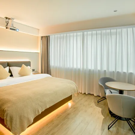 Orange Smart Enjoy Hotel (Guangchang Lotus Plaza)