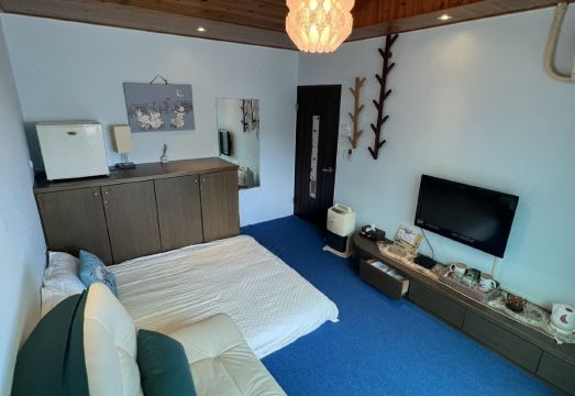 Qiaoyuan Bed and Breakfast의 아늑한 침실