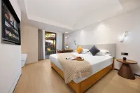 Slow Life Bali Coast Holiday Hotel - Inns