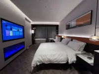 Xinglin Design Hotel (Luliang Jinhui Commercial City)