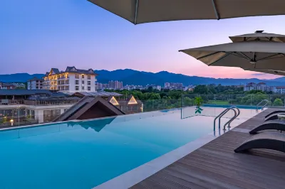 Huachen Yuexi Holiday Hotel (Xishuangbanna Jinghong Airport & Mengle Grand Buddha Temple Branch) Hotele w: Mannongfeng International Tourist Resort