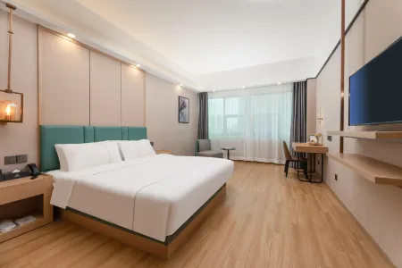 Zijin HuaJiYaShe Hotel (Changxing Dongyufang Jiuhuicheng) Отели рядом со станцией Changxing Railway Station