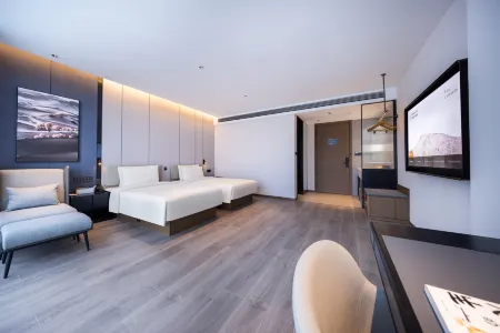 Qujing Qilin Garden South Gate Atour Hotel Отели в г. Цюйцзин