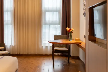 OM Home Hotel Отели рядом с достопримечательностью «Shaanxi Normal University - Museum»