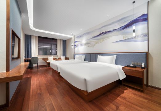 Ningbo Oriental New Century Grand Hotel의 넓고 깔끔한 객실