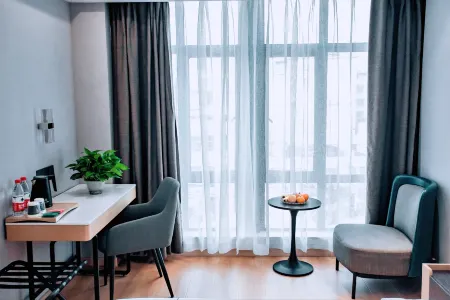 Magnotel Hotel (Huanggang Xishui Wen Yiduo Avenue) Отели в г. Сишуй