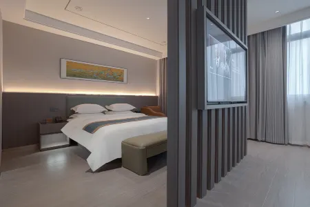 Xihua Shuangchuang Business Hotel Отели рядом с достопримечательностью «Jizi Reading Platform»