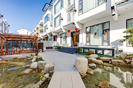 Pusu·Boyun Inn·Courtyard Fish Fun Homestay Отели рядом с достопримечательностью «Moon Bay (Yueliang Bay, Wuyuan)»