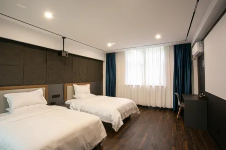 Xiwan Hotel (Yuanshiyu New Street) Отели рядом с достопримечательностью «Yanshi Museum»