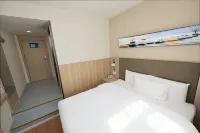 Xin Hao Hotel (Siping Central Hospital Qidao Street)